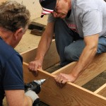 Jim and Peter build bookcases for the school