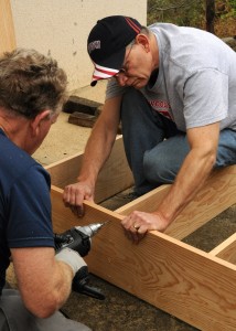 Jim and Peter build bookcases for the school